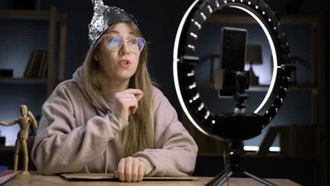 Strange crazy blogger with ring light and smartphone, paranoid woman streaming Stock-Footage 296993256