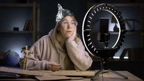 Strange crazy blogger with ring light and smartphone, paranoid woman streaming Stock-Footage 296993712