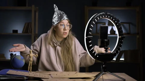 Strange crazy blogger with ring light and smartphone, paranoid woman streaming Stock Footage 296993932