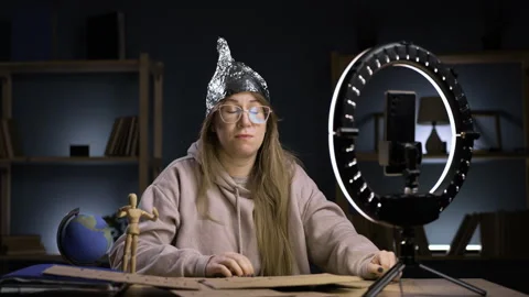 Strange crazy blogger with ring light and smartphone, paranoid woman streaming Stock Footage 296994199