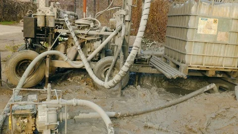 Strange dirty machine makes a well in clay 스톡 동영상 109377488