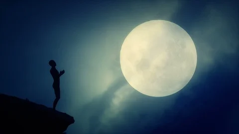 Strange Figure Praying to the Moon Stock Footage 122653638