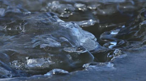 Strange Ice Blobs and Formations on Freezing River Stock Footage 12374513