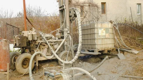 Strange machine makes a well Stock-Footage 109374491