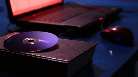 Strange office with laptop computer, DVD, a book and a mouse 스톡 동영상 20479629