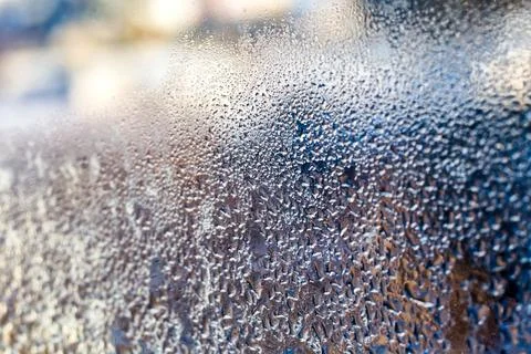 Strange patterns with drops on glass 스톡 사진