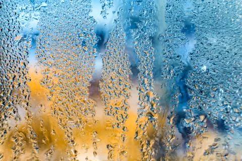 Strange patterns with drops on glass 스톡 사진