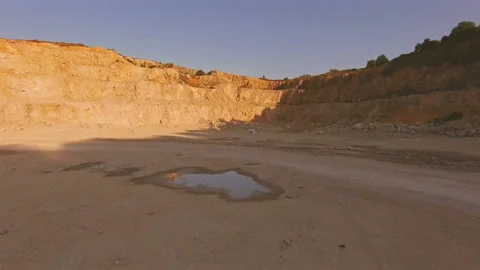 Strange traces in the puddle against the background of the yellow mountains and Stock-Footage 93006580