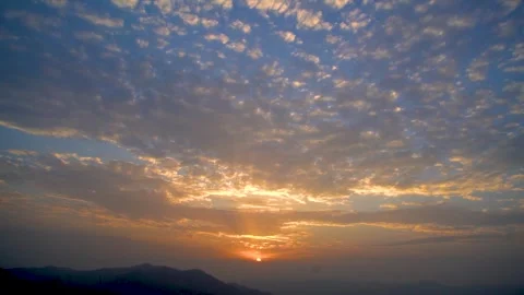 Strangely shaped clouds and sunlight natural landscape at sunset.Colorful sk Stock Footage 284445953