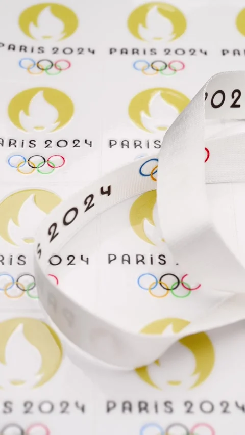 Strap and labels printed with Paris Olympic Games 2024 logo vertical composition Stock Footage 250300011