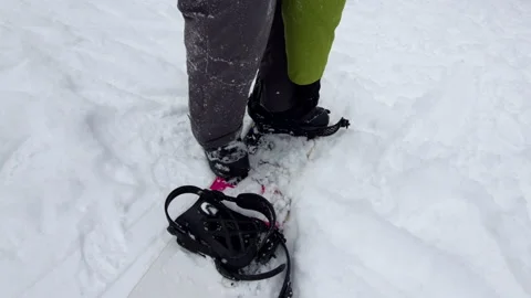 Strap in snowboard ski resort winter season Stock Footage 220552800