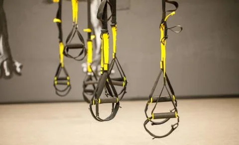 Straps training loop equipment. Black functional training equipment on grey b Stock Photos