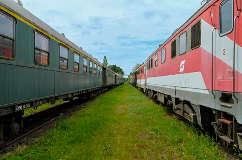 STRASSHOF, AUSTRIA - 06/19/2016: two parallel rails with trains Stock Photos