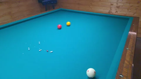 Strategic close-range cue impact in classic nine-pin billiard play Stock Footage 322612752