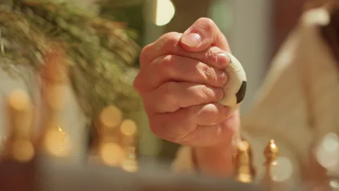 Strategic pause with gripping hands. Tense hands hold stress ball near chess Видео 345172441
