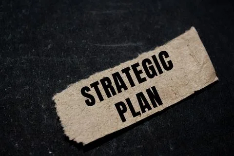 Strategic Plan message written on ripped torn paper background. Conceptual .. Stock Photos