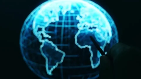 Strategist using a stylus pen to analyze a glowing digital world map. Stock Footage 338054411