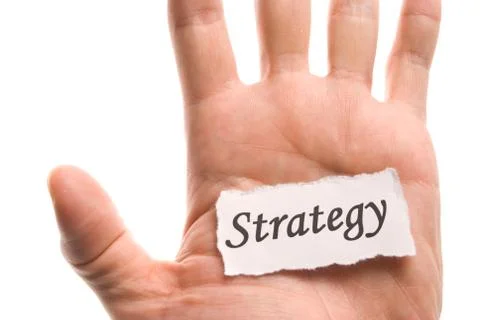 Strategy word in hand Fotos de archivo