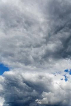 Stratocumulus clouds and the dark blue sky Stock Photos