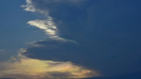 Stratocumulus Clouds Glowing at Sunset Over Gradient Sky Stock Footage 316885840