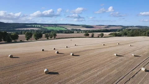 Straw bales in the fields from a drone, Southeast Scotland Stock-Footage 317346093
