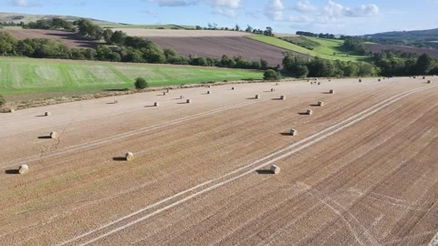 Straw bales in the fields from a drone, Southeast Scotland Stock-Footage 317346222