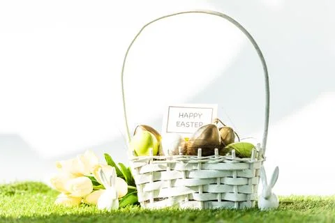 Straw basket colorful easter eggs Stock Photos