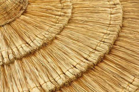 Straw beach umbrella close-up Stock Photos