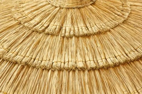 Straw beach umbrella close-up Stock Photos