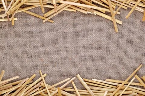 Straw on burlap Stock Photos