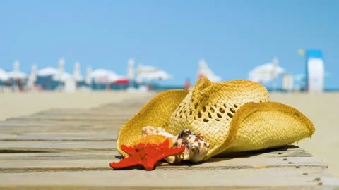 Straw hat and  starfish on a tropical beach. Stock Footage 135438618
