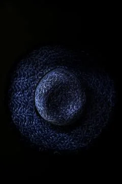 Straw hat on a black background Stock Photos