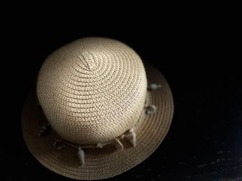 Straw hat on a black background Stock Photos