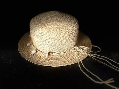 Straw hat on a black background Stock Photos