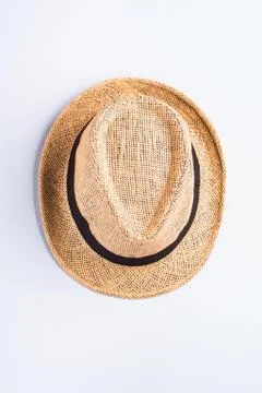 Straw hat on neutral gray background Stock Photos