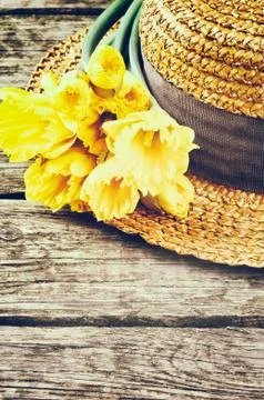 Straw hat with spring flowers Stock Photos