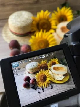 Straw Hat sunflowers on the table Stock Photos