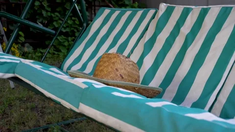 Straw hat on a swing 4K Stock Footage 160068319