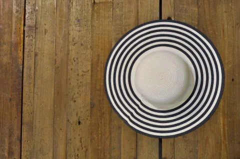 Straw hat on a table Stock Photos