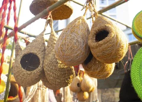 Straw nest kept for bird hatching. Handcrafted bird nest on shop for sale. Stock Photos