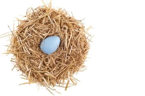 Straw nest with nice colored easter eggs Stock Photos