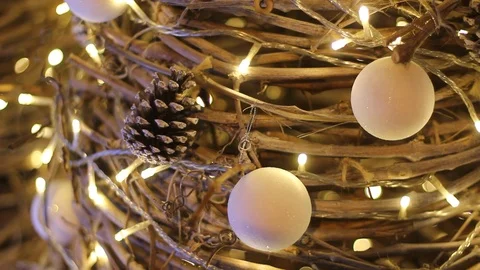Straw new year tree with cristmas balls, pine cones and garland Stock Footage 98611041