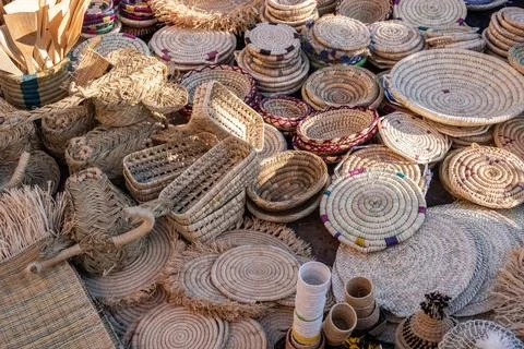 Straw objects in a market in a souk in marrakech. Stock Photos