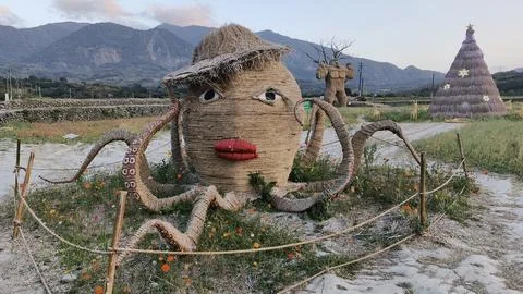 Straw octopus statue in the park Stock Photos