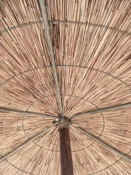Straw parasol as a background Stock Photos