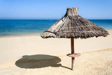 Straw parasol Stock Photos