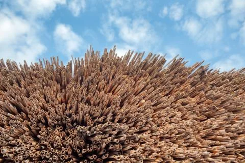 Straw pattern and blue sky with clouds. Background Stock Photos