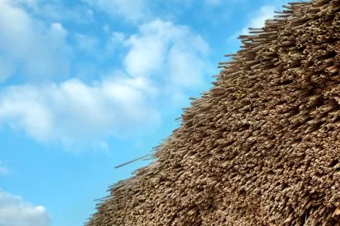 Straw pattern and blue sky with clouds. Background Stockfoto's