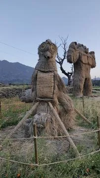 Straw statue in the park Stock Photos