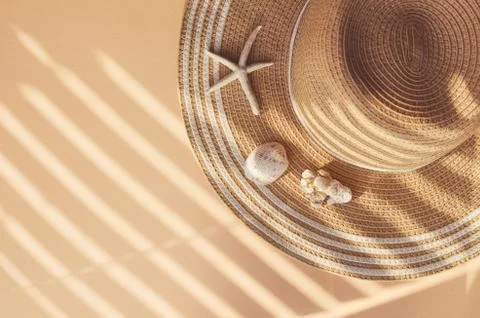 Straw summer hat with seashells and corals Stock Photos